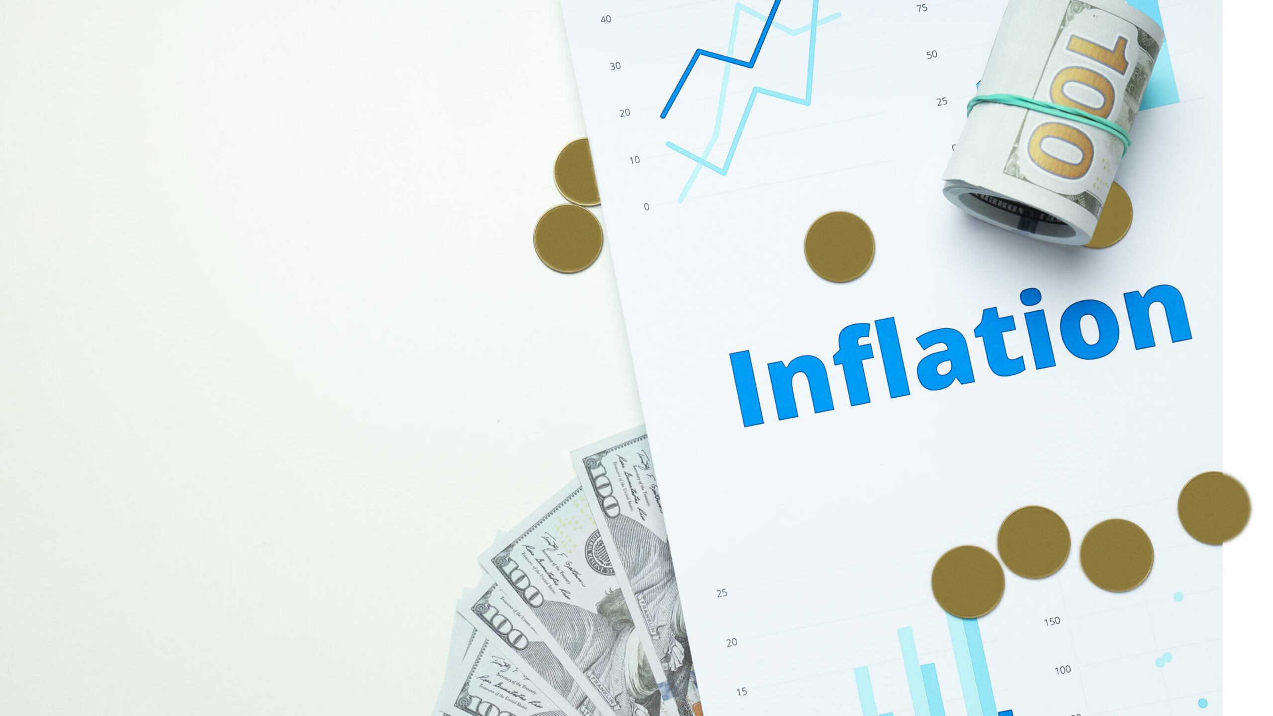 Rolled and fanned hundred-dollar bills, gold coins, and a rising financial chart labeled Inflation, symbolizing the impact of inflation on investment returns.