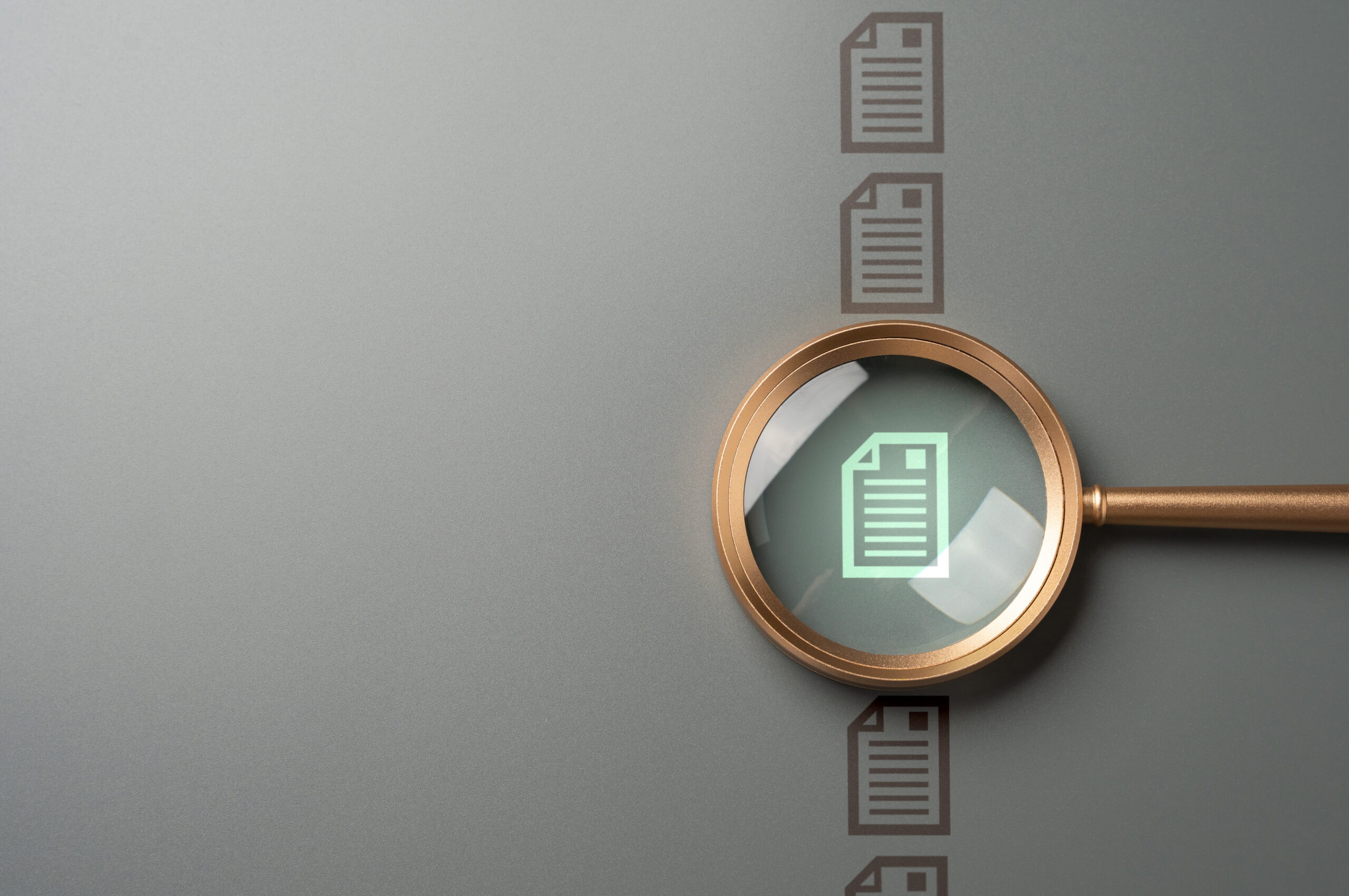Magnifying glass over a document representing due diligence on the risks of alternative assets in an IRA