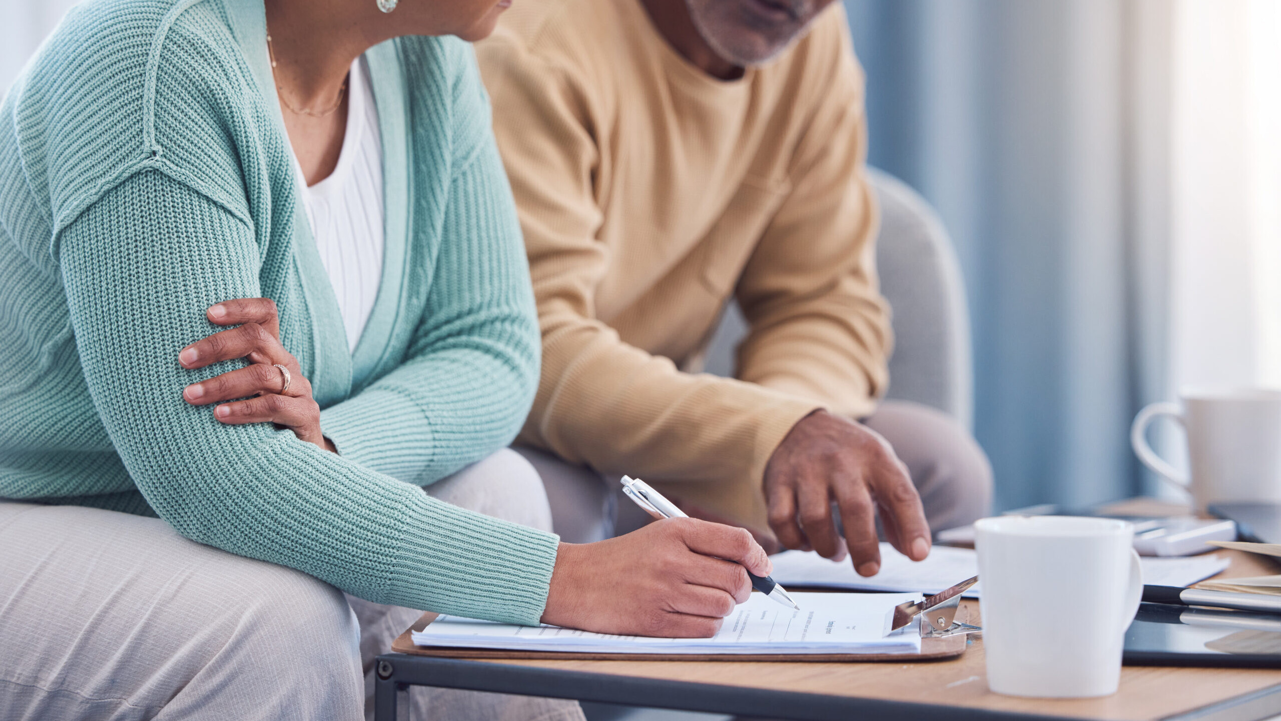 Retired couple reviewing their 401(k) plan’s alternative assets in target date funds