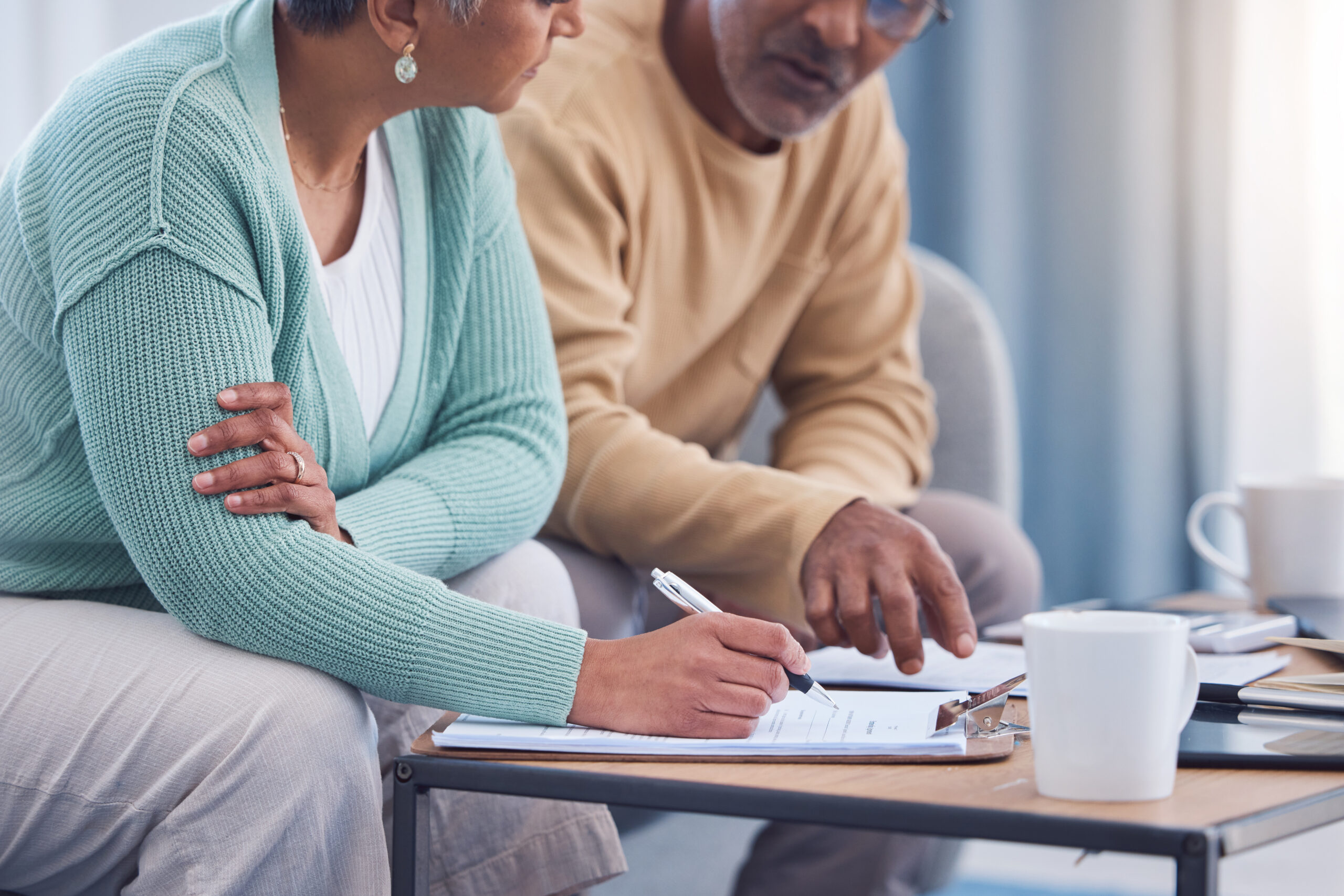 Retired couple reviewing their 401(k) plan’s alternative assets in target date funds