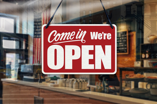a business sign that says, come in, we're open