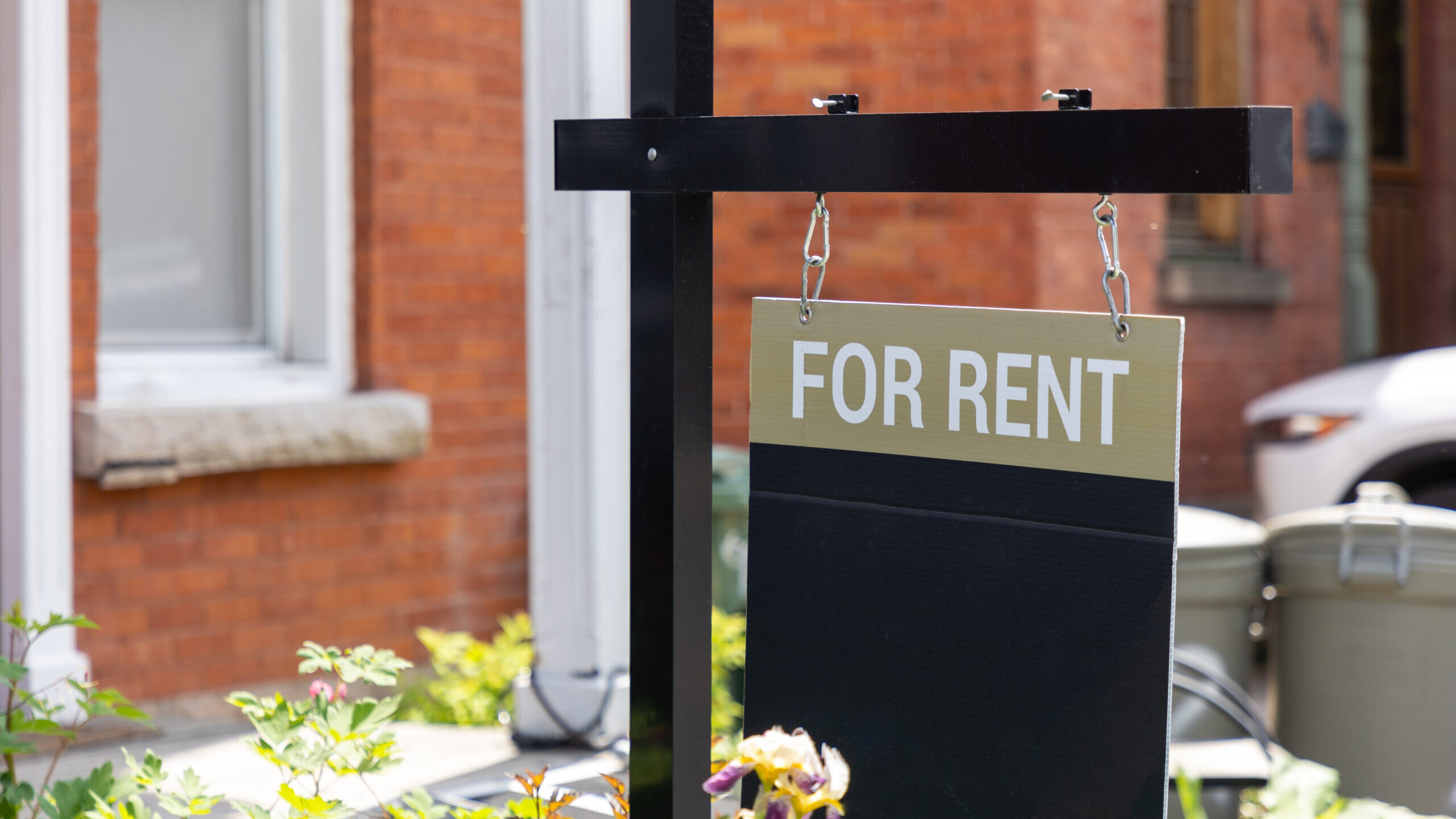 For rent sign in front of a residential building.