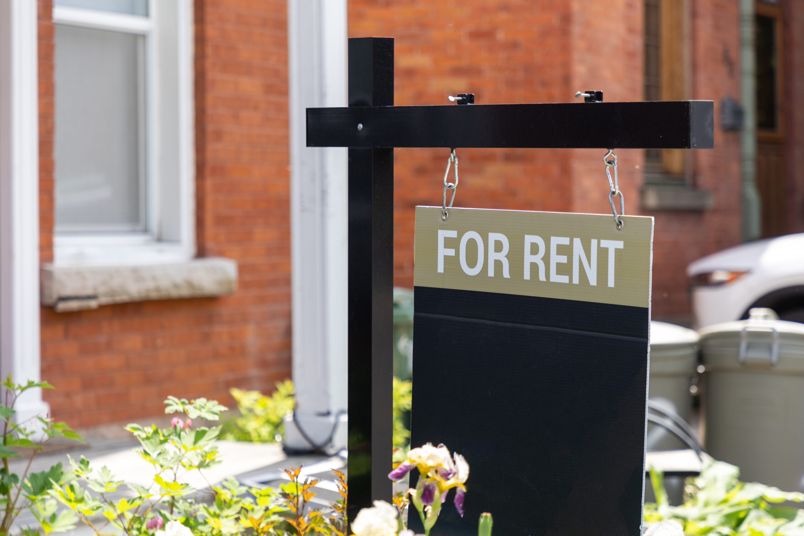 For rent sign in front of a residential building.