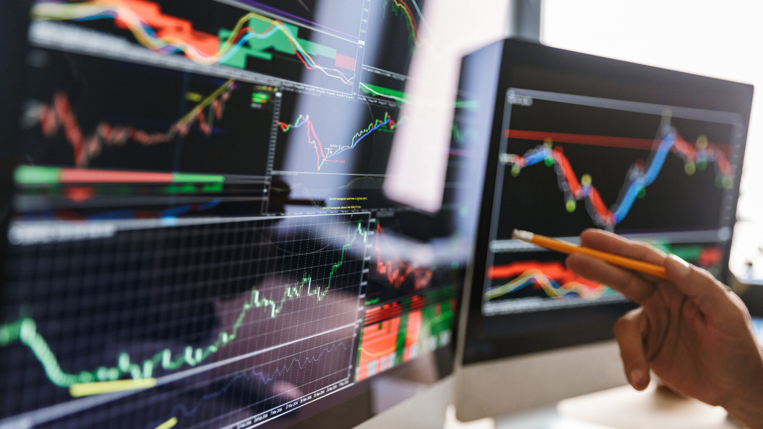 Investor analyzing crypto price charts before adding Solana to a Self-Directed IRA