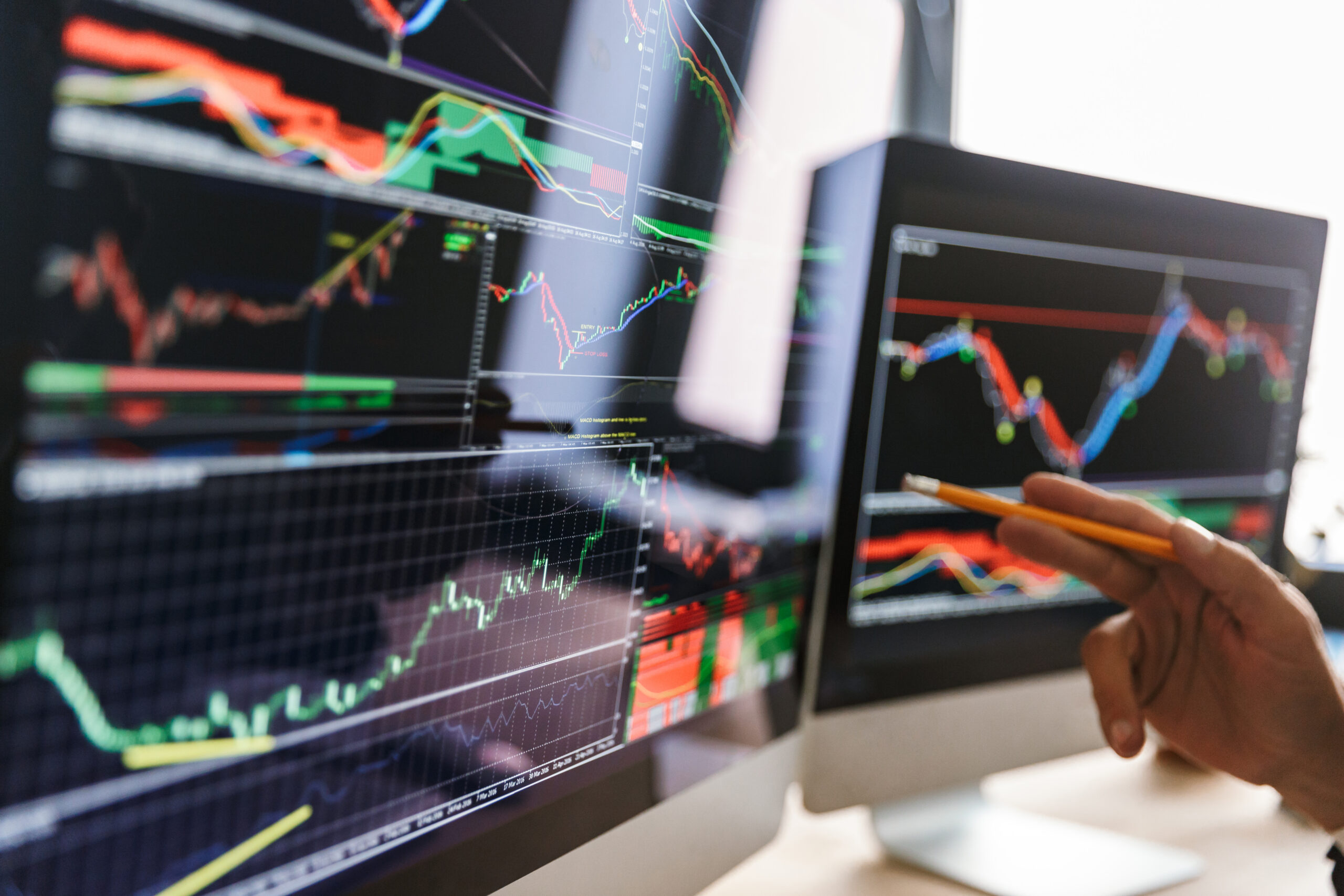 Investor analyzing crypto price charts before adding Solana to a Self-Directed IRA