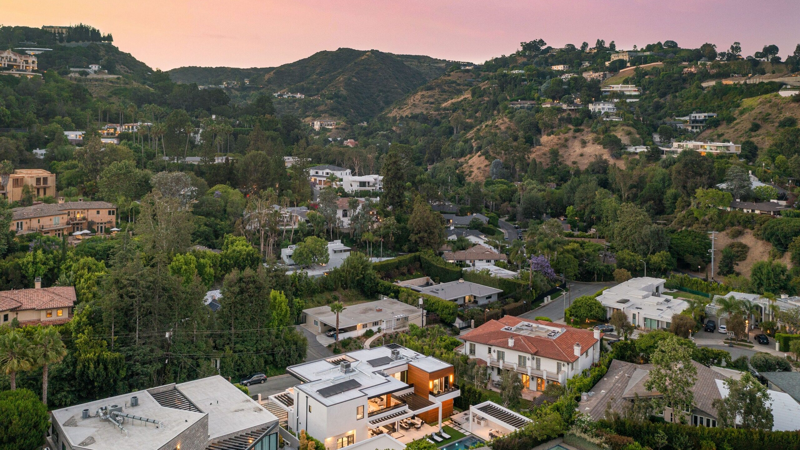 Luxury hillside homes in Los Angeles at sunset representing a Peter Thiel Roth IRA real estate strategy