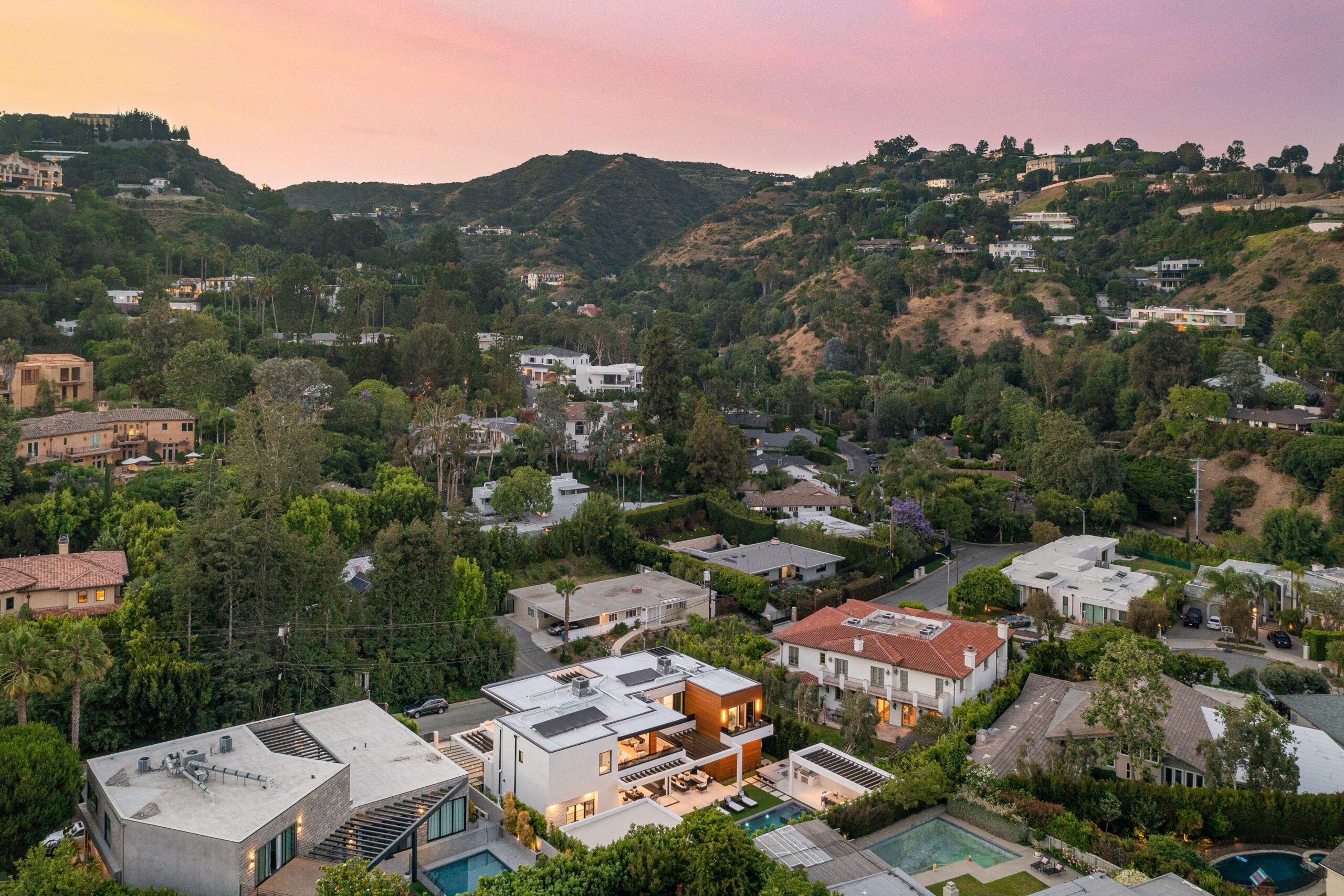 Luxury hillside homes in Los Angeles at sunset representing a Peter Thiel Roth IRA real estate strategy